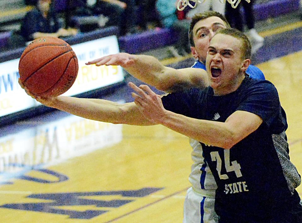 Dickinson State's Tyce Dahlberg puts up a shot against Mayville State's Thomas Gieske during the men's championship game of the North Star Athletic Association Basketball Final Four on Sunday, Feb. 26, 2023 in the Watertown Civic Arena.
