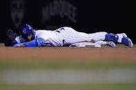 Chicago Cubs' Javier Baez waves to teammates after hitting a double against the Los Angeles Dodgers during the sixth inning of a baseball game in Chicago, Wednesday, May 5, 2021. (AP Photo/Nam Y. Huh)