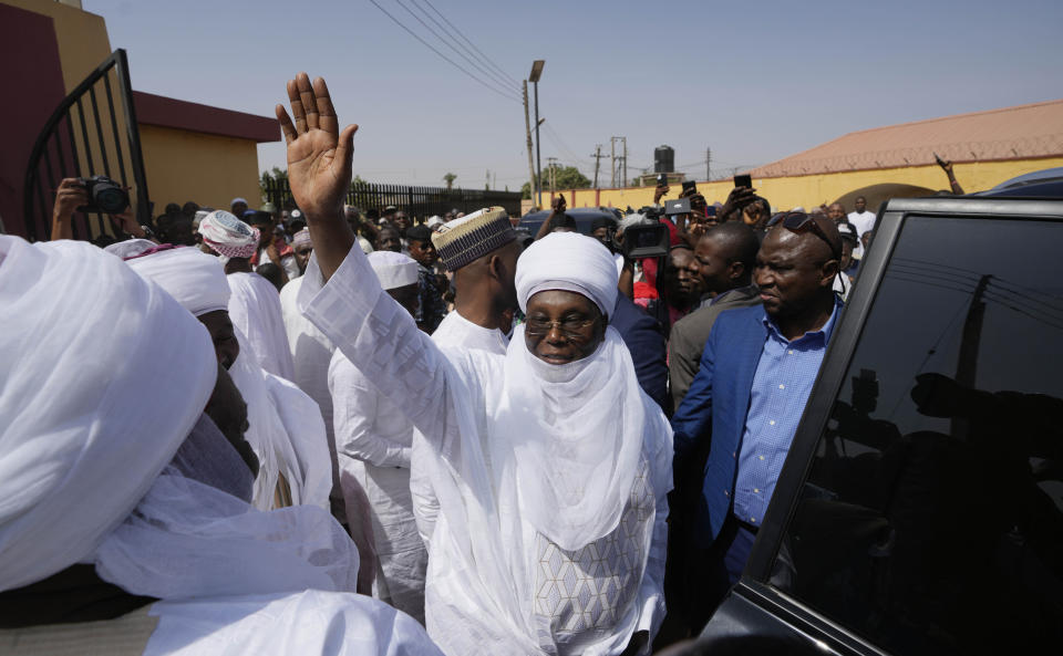 Atiku Abubakar, presidential candidate of the People's Democratic party, Nigeria's opposition party, centre, waves to his supporters after a traditional Friday prayers at the Moddibo Adama Mosque in Yola Nigeria, Friday, Feb. 24, 2023. On Feb. 25, voters will choose among 18 candidates in a first-round vote to succeed incumbent President Muhammadu Buhari, but despite being Africa's largest economy and and one of its top oil producers, Nigeria is in economic crisis. (AP Photo/Sunday Alamba)