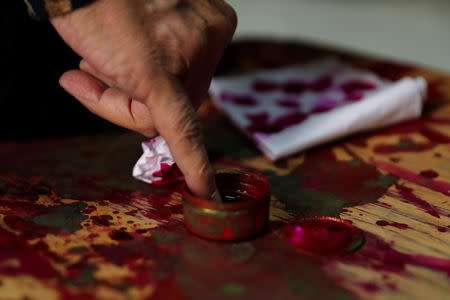 A man has his finger stained with ink during the second day of the referendum on draft constitutional amendments, at a polling station in Cairo, Egypt April 21, 2019. REUTERS/Amr Abdallah Dalsh