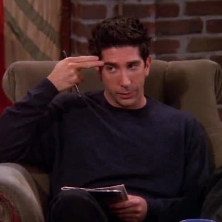 Ross making gun-fingers against his head