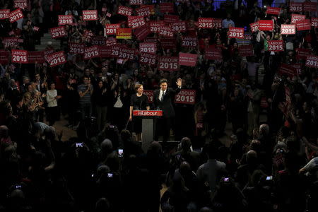 Britain's opposition Labour Party leader Ed Miliband waves next to his wife after delivering an election speech to supporters at the Royal Horticultural Halls in London, Britain May 2, 2015. REUTERS/Stefan Wermuth