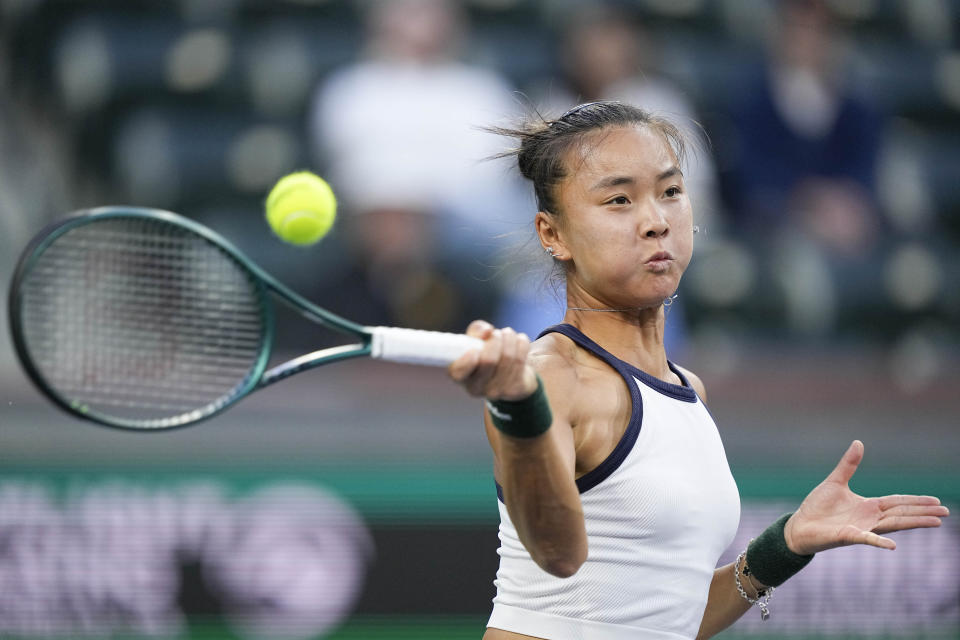 Yue Yuan, of China, returns to Daria Kasatkina, of Russia, at the BNP Paribas Open tennis tournament, Wednesday, March 13, 2024, in Indian Wells, Calif. (AP Photo/Mark J. Terrill)