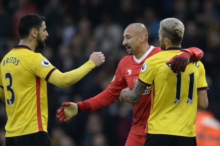 Football Soccer Britain - Watford v Everton - Premier League - Vicarage Road - 10/12/16 Watford's Heurelho Gomes celebrates after the game with Valon Behrami and Miguel Britos Action Images via Reuters / Alan Walter Livepic EDITORIAL USE ONLY. No use with unauthorized audio, video, data, fixture lists, club/league logos or "live" services. Online in-match use limited to 45 images, no video emulation. No use in betting, games or single club/league/player publications. Please contact your account representative for further details.