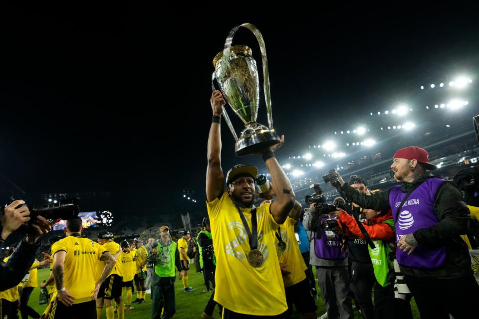 Crew defender Steven Moreira, here hoisting the Philip J. Anschutz Trophy after defeating LAFC in the MLS Cup championship, has signed a contract extension with Columbus.