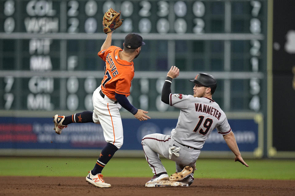 Arizona Diamondbacks' Josh VanMeter (19) looks back after being tagged out by Houston Astros second baseman Jose Altuve while trying to steal second base during the eighth inning of a baseball game Friday, Sept. 17, 2021, in Houston. (AP Photo/David J. Phillip)