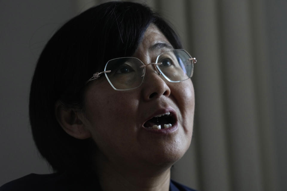 Activist Wang Yu, who found that her COVID-19 health app changed color and prevented her from traveling, speaks during an interview, Thursday, June 30, 2022, in Beijing. There was no evidence that she was sick or had been exposed to the virus. (AP Photo/Ng Han Guan)