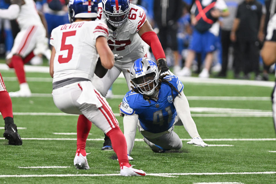 Aug 11, 2023; Detroit, Michigan, USA; Detroit Lions linebacker James Houston (41) dives for New York Giants quarterback Tommy DeVito (5) in the fourth quarter at Ford Field. Mandatory Credit: Lon Horwedel-USA TODAY Sports