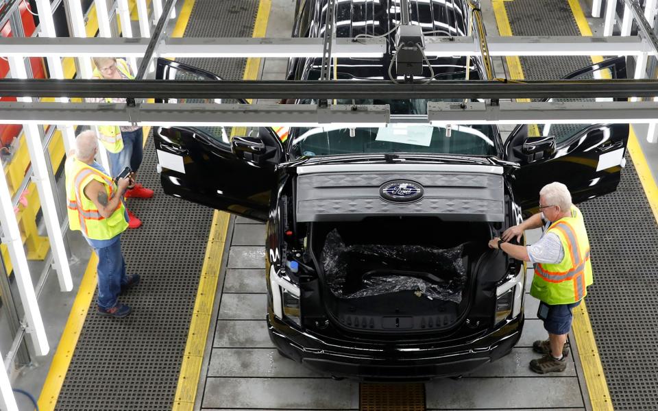 A Ford battery-powered F-150 Lightning truck under production at  Dearborn, Michigan, 2022