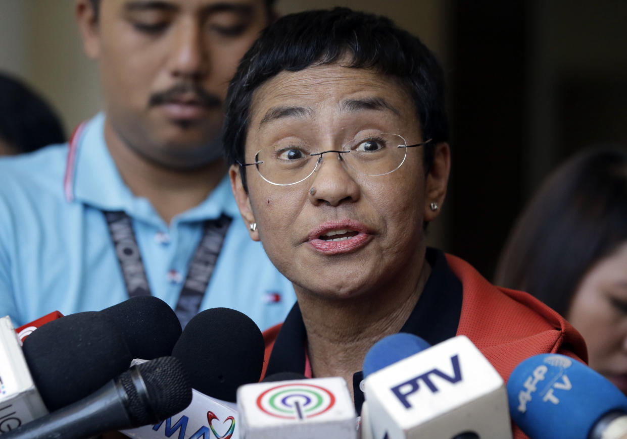 FILE - In this March 29, 2019 file photo, Rappler CEO and Executive Editor Maria Ressa talks to reporters after posting bail at the Pasig Regional Trial Court, metropolitan Manila, Philippines. On Friday, Oct. 8, 2021 the 2021 Nobel Peace Prize was awarded to journalists Maria Ressa and Dmitry Muratov for the fight for freedom of expression in the Philippines and in Russia. (AP Photo/Aaron Favila, file)