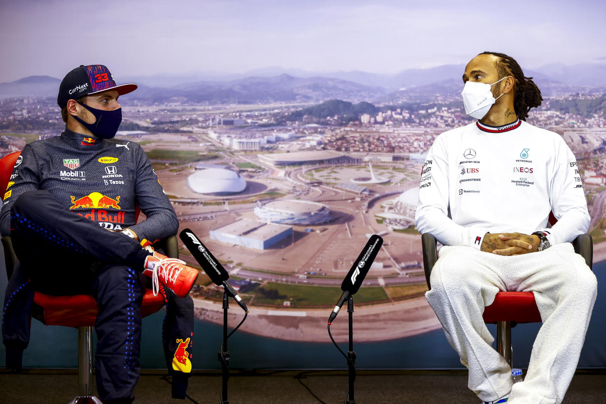 SOCHI, RUSSIA - SEPTEMBER 26: Race winner Lewis Hamilton of Great Britain and Mercedes GP and second placed Max Verstappen of Netherlands and Red Bull Racing talk in the press conference after the F1 Grand Prix of Russia at Sochi Autodrom on September 26, 2021 in Sochi, Russia. (Photo by Andy Hone - Pool/Getty Images)