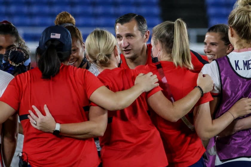 Yokiohama, Japan, Friday, July 30, 2021 - USA coach Vlatko Andonovski talks with his team after beating Netherlands in the Tokyo 2020 Olympics Women's Football Quarterfinal at International Stadium Yokohama. (Robert Gauthier/Los Angeles Times)