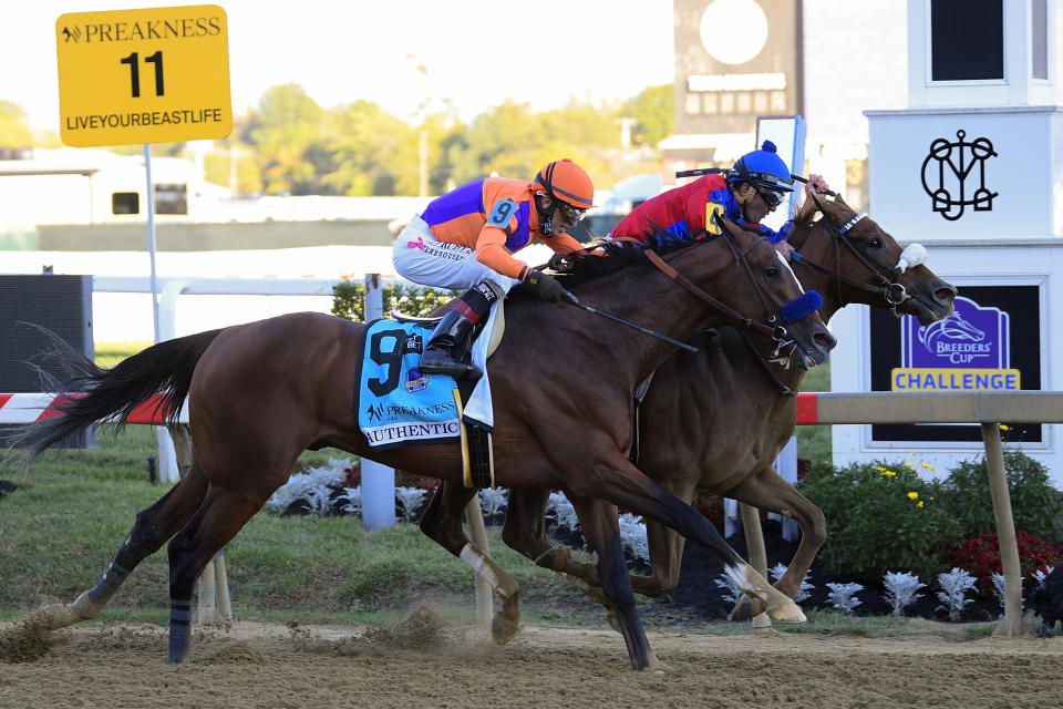 Swiss Skydiver, right, ridden by Robby Albarado, leads Authentic, ridden by John Velazquez, to win the 145th Preakness Stakes horse race at Pimlico Race Course, Saturday, Oct. 3, 2020, in Baltimore. (AP Photo/Nick Wass)