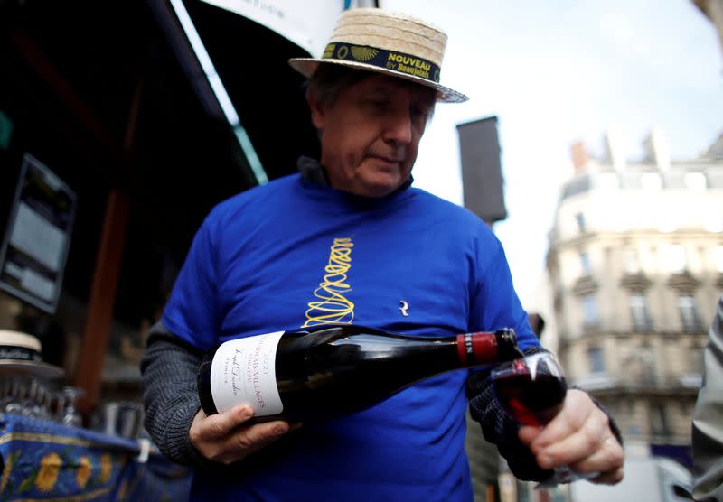 FILE PHOTO: Parisians celebrate Beaujolais Nouveau wine in Paris