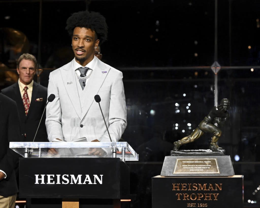 LSU quarterback Jayden Daniels speaks after winning the Heisman Trophy as college football player of the year, Saturday, Dec. 9, 2023, in New York. (Todd Van Emst/Pool Photo via AP)