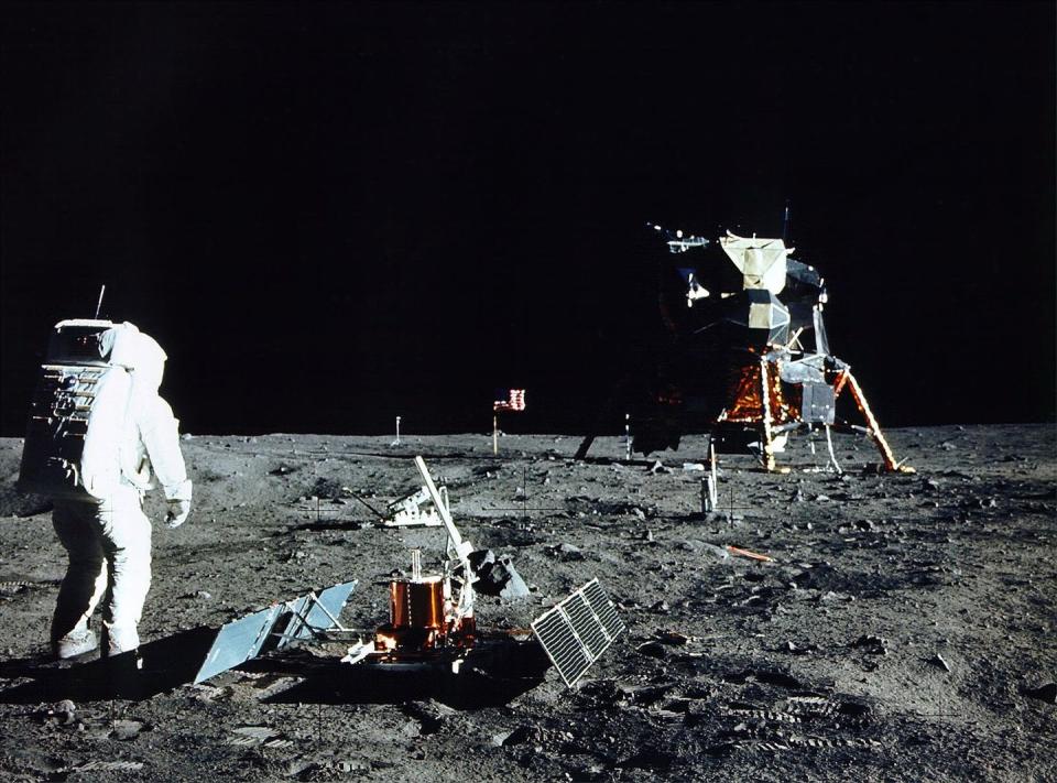 <p>Aldrin stands near a scientific experiment on the lunar surface. </p>