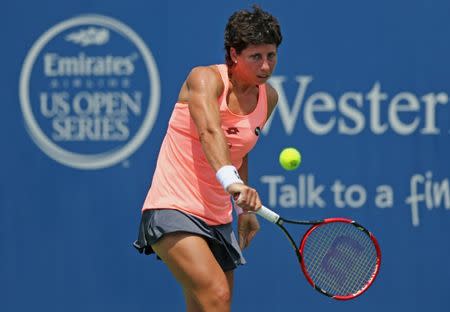 Aug 19, 2016; Mason, OH, USA; Carla Suarez Navarro (ESP) returns a shot against Angelique Kerber (GER) in the quarterfinals during the Western and Southern tennis tournament at Linder Family Tennis Center. Mandatory Credit: Aaron Doster-USA TODAY Sports