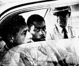 FILE - In this February 1964 file photo, Henry Montgomery, flanked by two deputies, awaits the verdict in his trial for the murder of Charles H. Hurt, a sheriff’s deputy in Baton Rouge, La. Montgomery, the subject of a 2016 Supreme Court ruling, has been behind bars for more than a half-century. He was denied parole in 2018. Now 72, he will be eligible for another hearing February 2019. (John Boss/The Advocate via AP, File)