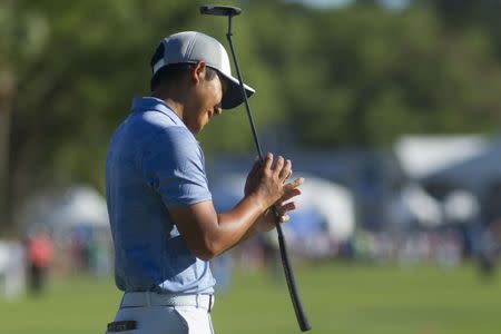 Apr 21, 2019; Hilton Head, SC, USA; C.T. Pan reacts after missing a putt on the green of the eighteenth hole during the final round of the RBC Heritage golf tournament at Harbour Town Golf Links. Mandatory Credit: Joshua S. Kelly-USA TODAY Sports