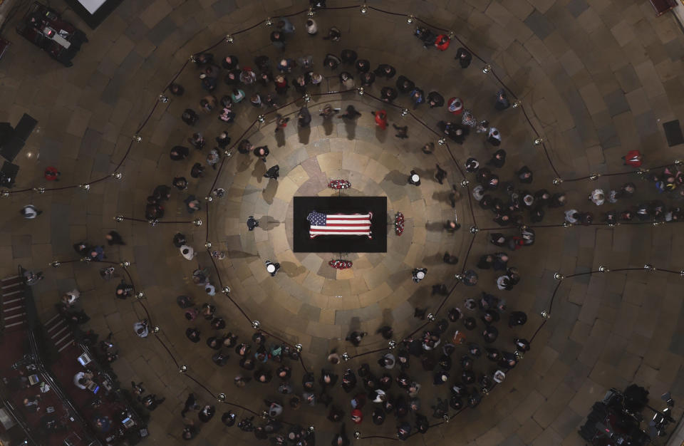 Former President George H. W. Bush lies in state in the U.S. Capitol Rotunda Tuesday, Dec. 4, 2018, in Washington. (Pool photo by Morry Gash via AP)