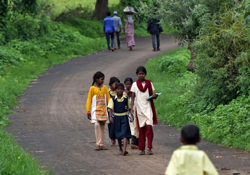 FILE PHOTO: Schoolchildren learn with the help of pre-recorded lessons in Dandwal village, Maharashtra
