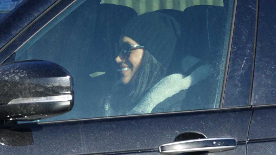 The Duchess of Sussex was photographed driving and picking up her friend at the airport.