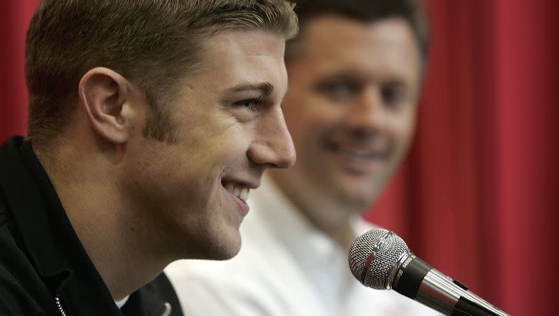 Utah quarterback Alex Smith, left, answers questions during a news conference on Jan. 4, 2005, in Salt Lake City. Smith announced his plans to skip his senior year to enter the NFL draft after leading the team to a 12-0 record and a Fiesta Bowl victory this season. Head coach Kyle Whittingham, right, listens to Smith’s comments.