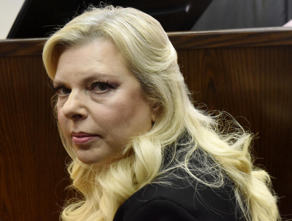 FILE - In this June 16, 2019 file photo, Sara Netanyahu, the wife of Israeli Prime Minister Benjamin Netanyahu, appears in the Magistrate Court, for a hearing on a plea deal over the misuse of state funds for meals at the premier's residence, in Jerusalem. Netanyahu may have violated the country's coronavirus lockdown by inviting a hairdresser into the official residence last week to prepare her for a public service video advocating the wearing of masks. The Yediot Ahronot newspaper reported Wednesday, Oct. 7, 2020, that Sara Netanyahu had a hairdresser visit on the eve of the festive Sukkot holiday. (Debbie Hill/Pool Photo via AP, File)