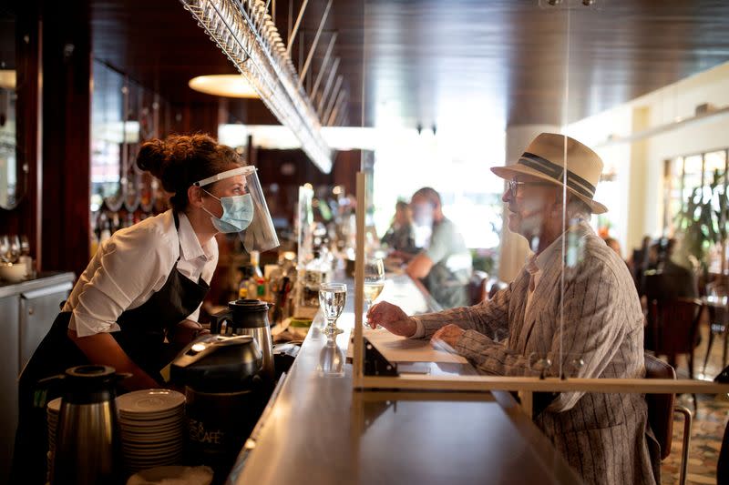 FILE PHOTO: Patrons return to restaurants as coronavirus restrictions lifted to visit restaurants in Montreal