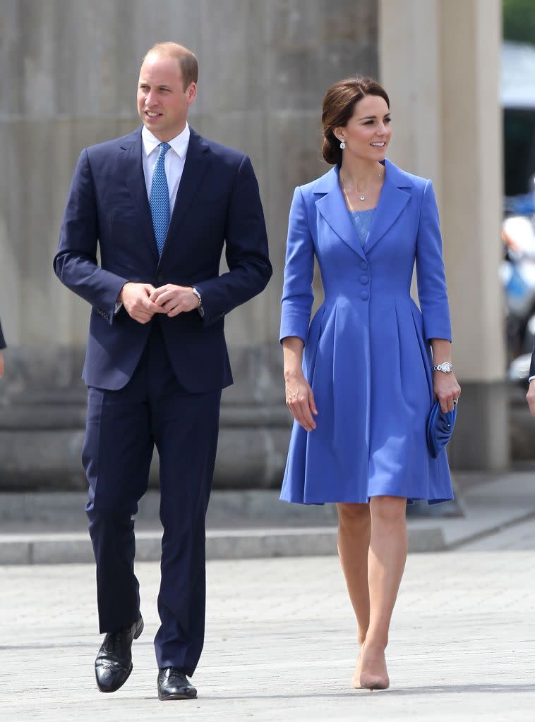 <p>Duchess Kate tours Berlin in a custom cornflower blue Catherine Walker coat paired with her favorite nude pumps.</p>