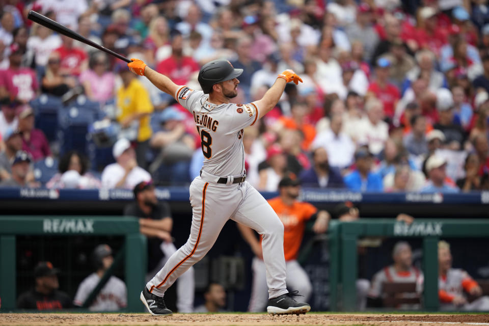 San Francisco Giants' Paul DeJong follows through after hitting a two-run home run against Philadelphia Phillies pitcher Michael Lorenzen during the fourth inning of a baseball game, Wednesday, Aug. 23, 2023, in Philadelphia. (AP Photo/Matt Slocum)