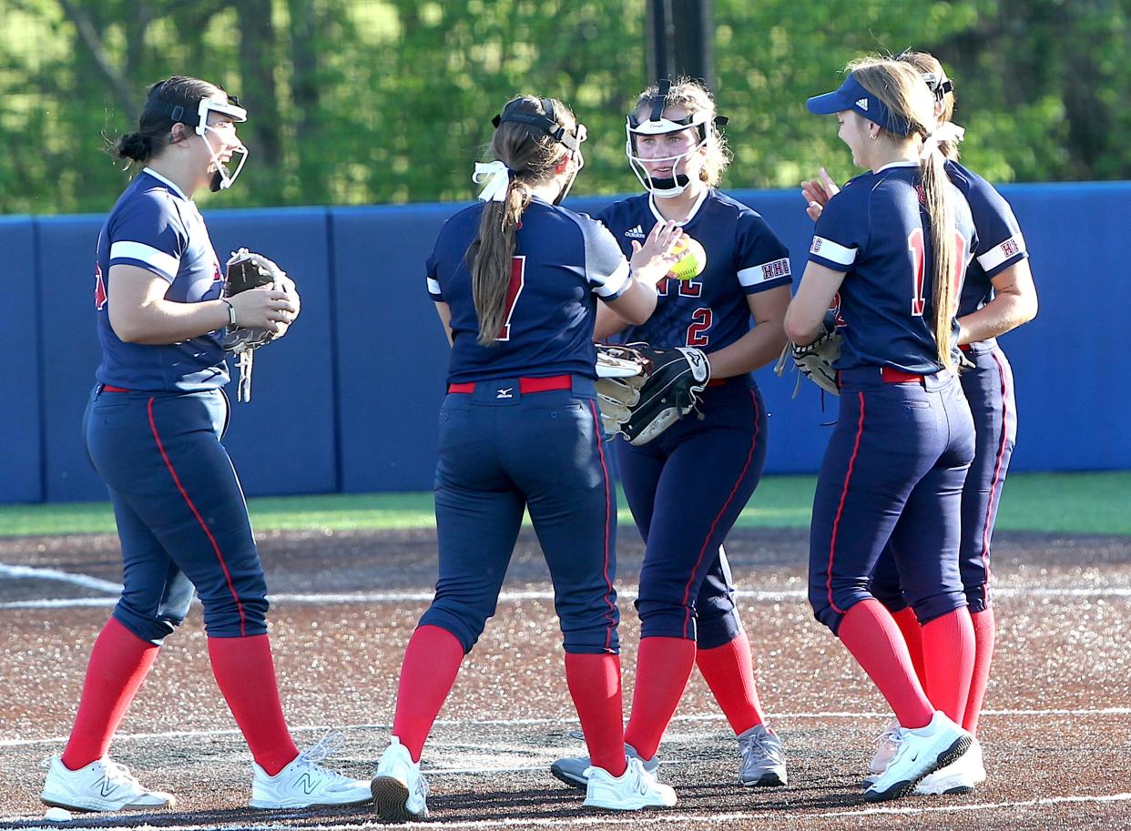 Bedford North Lawrence pitcher Macee Nicholson (2, center) is congratulated by teammates after getting an out. Nicholson pitched in relief for Aliza Jewell on Monday, April 29, 2024.