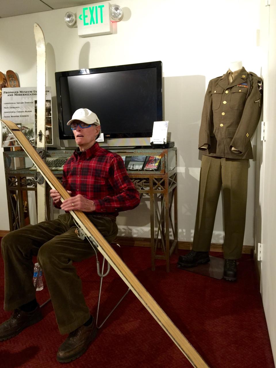 Sandy Treat shows off a 7-foot-long hickory ski of the kind he used while fighting and training with the 10th Mountain Division in Colorado. Treat, now 92, was 19 years old when he volunteered to join the Army and help create the first true mountain division, which fought in Italy to dislodge Germans from mountain passes.