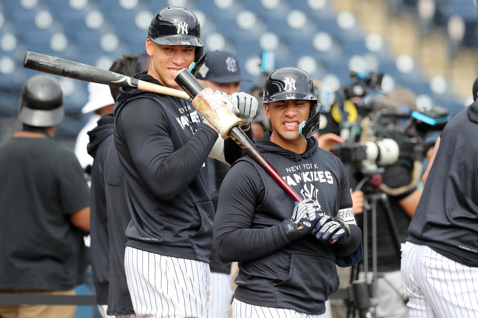 TAMPA, FL - MARCH 16: New York Yankees outfielder Aaron Judge (99) and infielder Gleyber Torres (25) look over towards teammates during the Yankees spring training workout on March 16, 2022, at Steinbrenner Field in Tampa, FL. (Photo by Cliff Welch/Icon Sportswire via Getty Images)