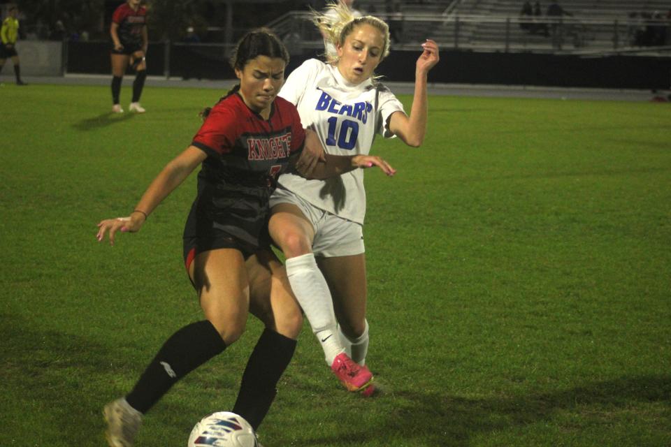 Creekside fullback Braelyn McMillan (7) and Bartram Trail forward Macey Millard (10) challenge for possession during the FHSAA District 1-7A girls soccer final on February 1, 2024. [Clayton Freeman/Florida Times-Union]