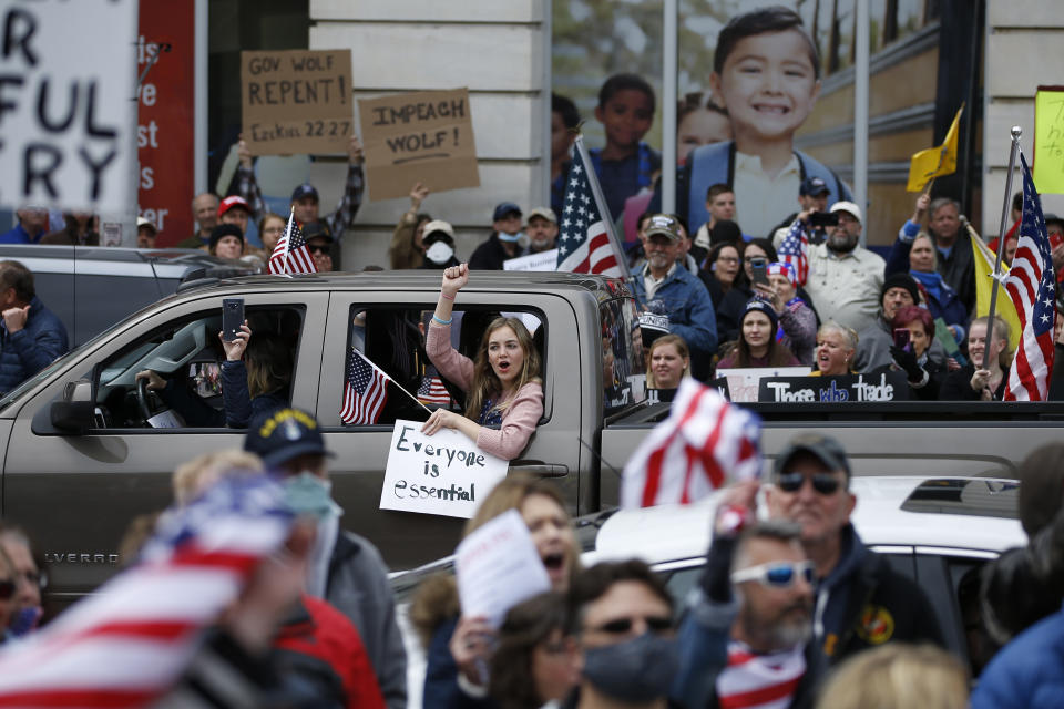 FILE - In this April 20, 2020, file photo, protesters demonstrate during a rally against Pennsylvania's coronavirus stay-at-home order. Republican lawmakers across the country have tried to roll back the emergency powers that governors wielded during the COVID-19 pandemic, as they ordered businesses and schools shut and mask-wearing in public. On Tuesday, May 18 Pennsylvania’s GOP-controlled Legislature is taking its case to voters, in twin constitutional amendments on the primary ballot that would give lawmakers much more power over disaster declarations, whether another pandemic or a natural disaster.(AP Photo/Matt Slocum, File)