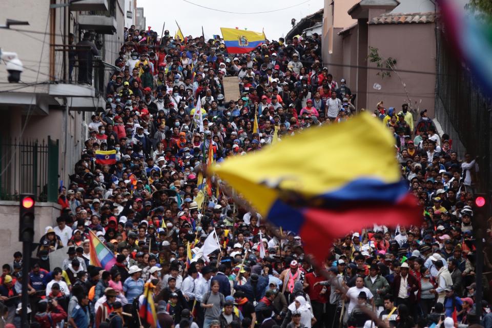 Anti-government demonstrators march against President Lenin Moreno and his economic policies during a nationwide strike, in Quito, Ecuador, Wednesday, Oct. 9, 2019. Ecuador's military has warned people who plan to participate in a national strike over fuel price hikes to avoid acts of violence. The military says it will enforce the law during the planned strike Wednesday, following days of unrest that led Moreno to move government operations from Quito to the port of Guayaquil. (AP Photo/Carlos Noriega)