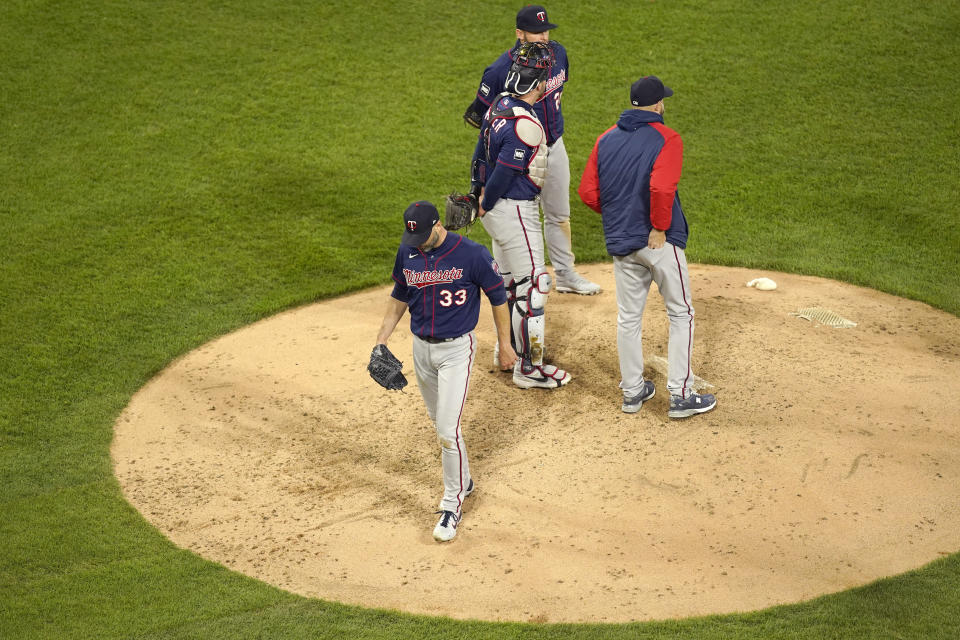 Minnesota Twins starting pitcher J.A. Happ (33) walks off the mound after being relieved by manager Rocco Baldelli during the fourth inning of a baseball game against the Chicago White Sox Wednesday, May 12, 2021, in Chicago. (AP Photo/Charles Rex Arbogast)