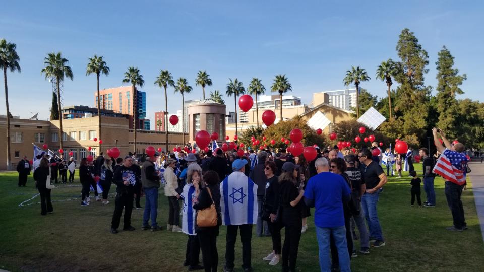 A crowd is seen during a rally Sunday, Dec. 3, 2023 at Hayden Lawn at Arizona State University in Tempe. Attendees stood in support of releasing Hamas hostages.