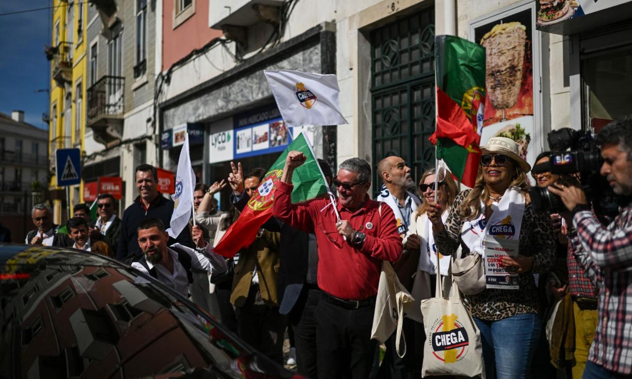 <span>Far-right Chega party supporters are anti-immigration and anti-corruption, believing ‘Portugal needs cleaning out’.</span><span>Photograph: Patrícia de Melo Moreira/AFP/Getty Images</span>