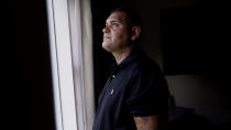 Mike Gilpatrick, who as a teenager was incarcerated at the Youth Development Center, waits for his children to return from school at their home, Wednesday, Sept. 8, 2021, in Nashua, N.H. Gilpatrick, 38, filed a lawsuit Monday Sept. 13, alleging he was physically and sexually abused at the former YDC in Manchester, which has been the target of a criminal investigation since 2019 and is slated to close in 2023. (AP Photo/Charles Krupa)