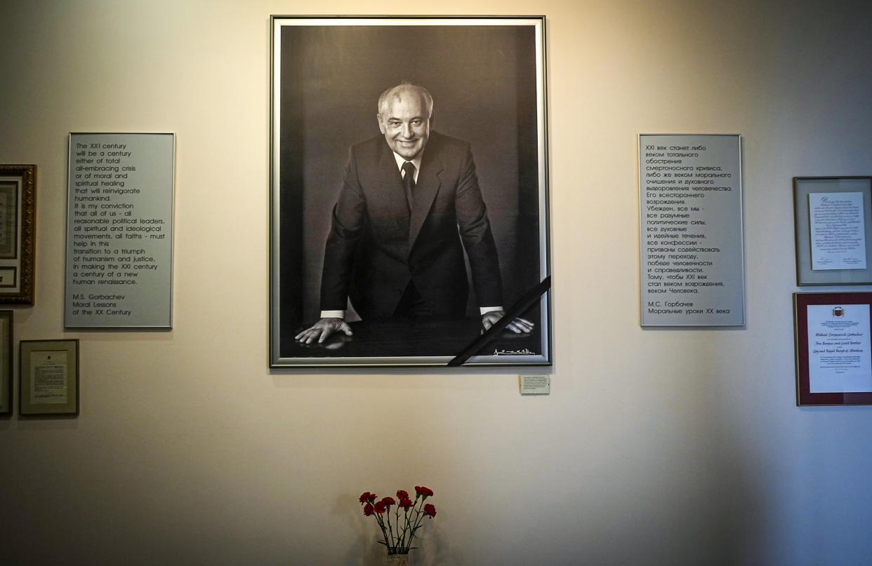 Image: A portrait of the former Soviet President Mikhail Gorbachev and flowers are placed at his foundation's headquarters, a day after his passing, in Moscow on Aug. 31, 2022. (Alexander Zemlianichenko / AP)
