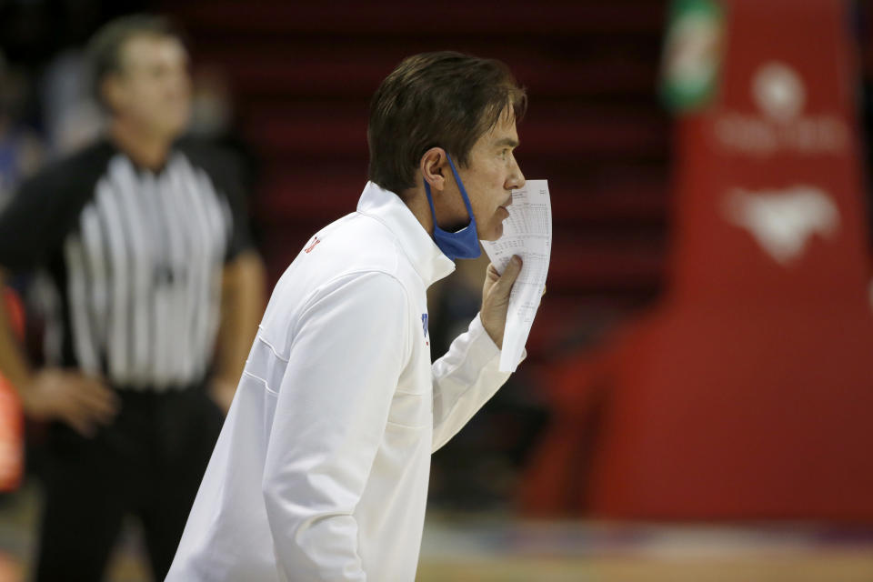 SMU head coach Tim Jankovich talks to his players from the sideline during the first half of an NCAA college basketball game in Dallas, Sunday, Jan. 3, 2021. (AP Photo/Roger Steinman)