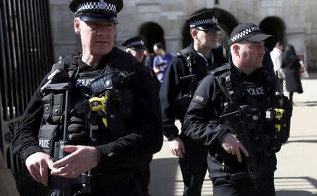 Armed police patrol the streets following the attack in Westminster earlier in the week, in central London, Britain March 26, 2017. REUTERS/Neil Hall