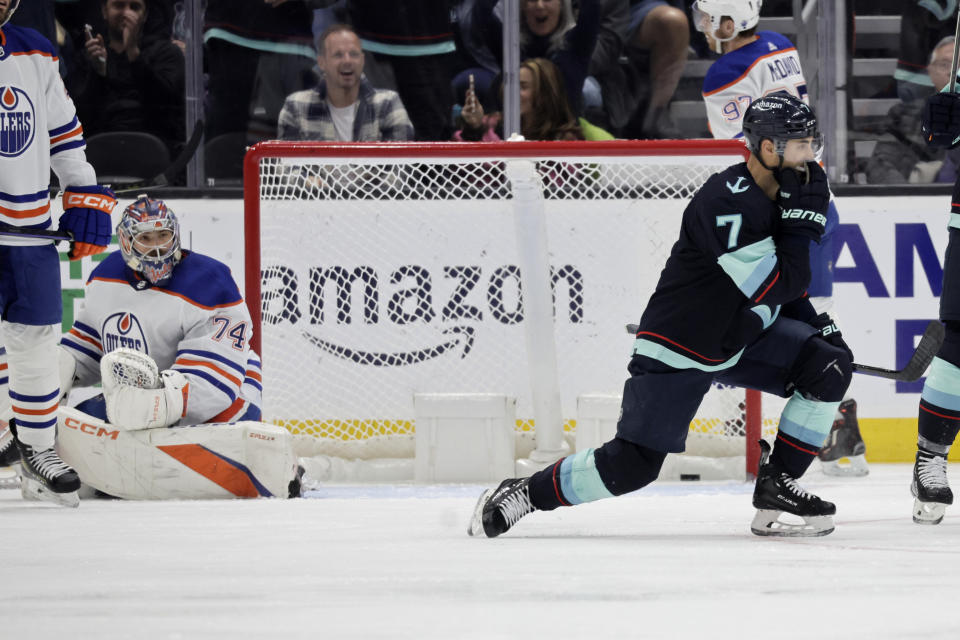 Seattle Kraken right wing Jordan Eberle (7) pumps his fist after scoring a goal against Edmonton Oilers Edmonton Oilers goaltender Stuart Skinner (74) during the second period of an NHL hockey game, Saturday, March 18, 2023, in Seattle. (AP Photo/John Froschauer)