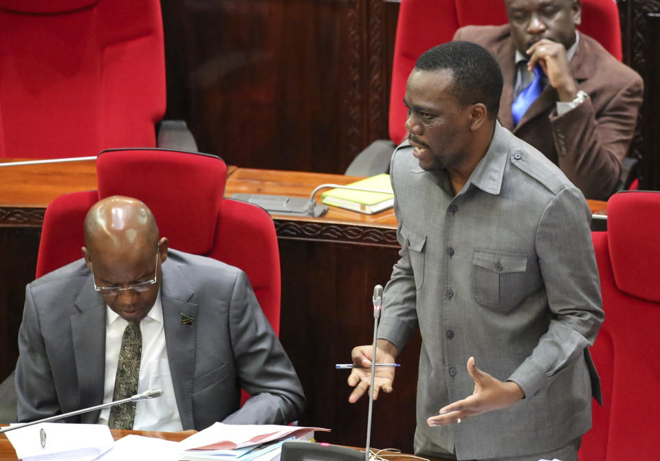 FILE - In this Friday, May 5, 2017 file photo, Tanzanian opposition politician Zitto Kabwe, right, speaks at the national assembly in Dodoma, Tanzania. Tanzanians are due to go to the polls on Wednesday, Oct. 28, 2020 with the future of one of Africa's most populous countries at stake and, at least before the COVID-19 pandemic, one of its fastest-growing economies. (AP Photo, File)