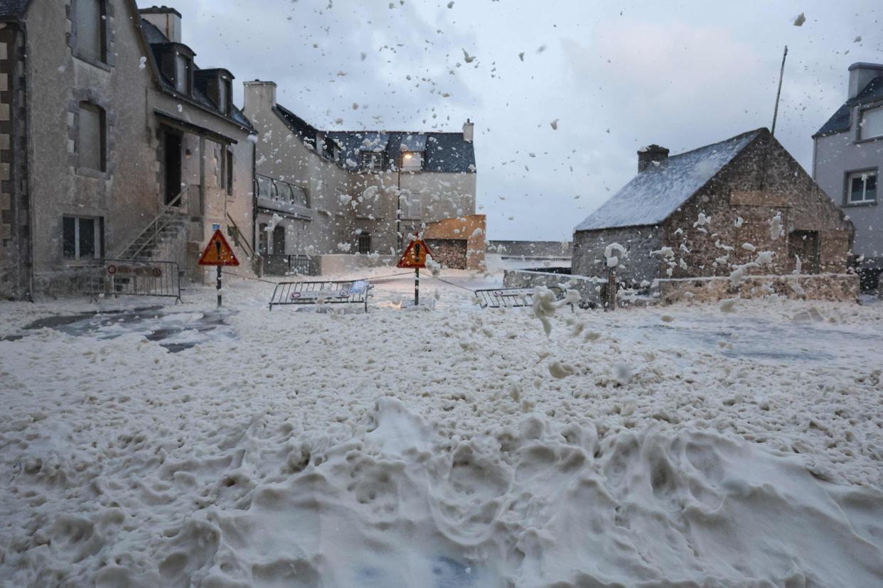 Sea foam coats the streets of Penmarc’h, western France (AFP via Getty Images)