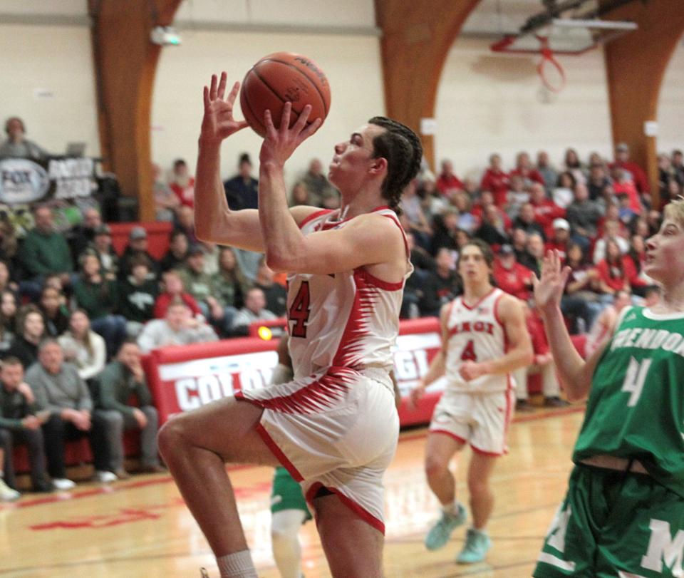 Maverick Downs heads in for two points against Mendon in the district finals on Friday.