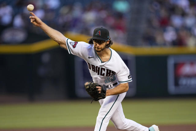 Arizona Diamondbacks' Zac Gallen walks to the dugout after