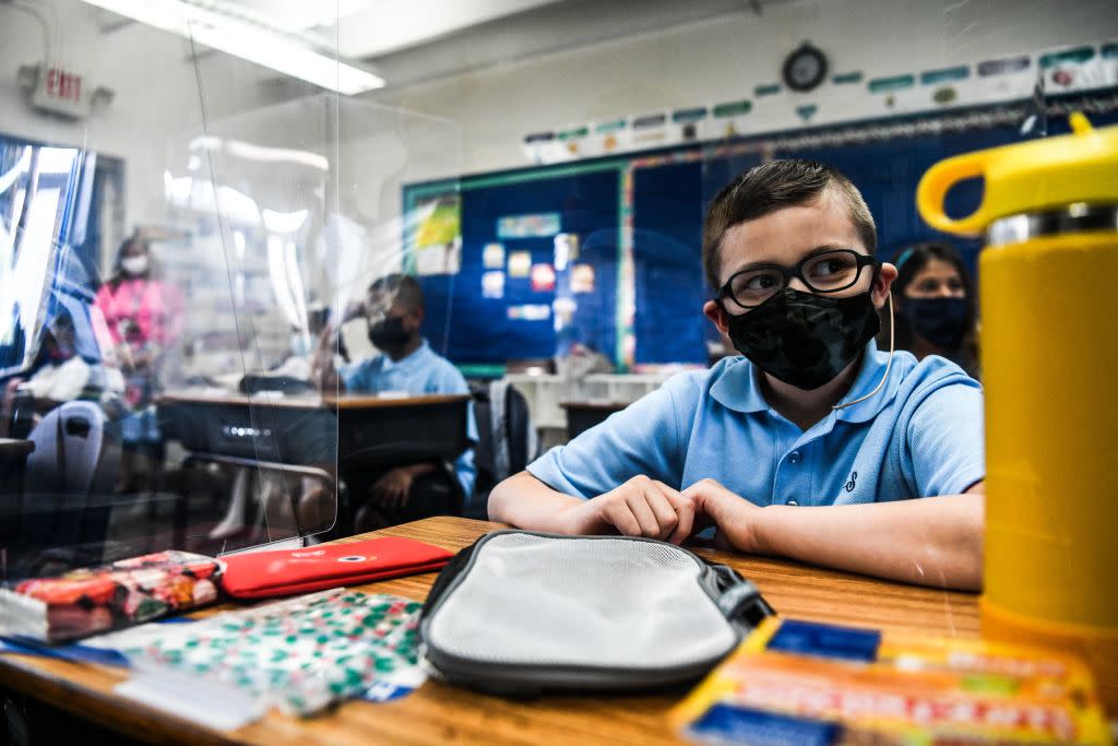 Students wear face masks on their first day in school at St. Lawrence Catholic School near Miami.